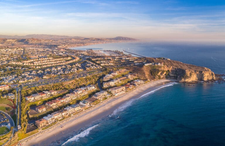 California Earthquake insurance pros and cons Aerial view of the California coast and ocean in Dana Point, Ora