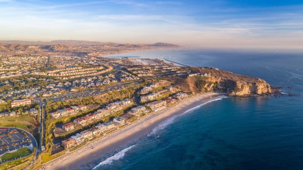 California Earthquake insurance pros and cons Aerial view of the California coast and ocean in Dana Point, Ora